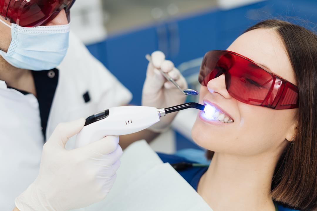Patient receiving a teeth whitening treatment